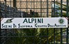 Gate sign with Alpine crests.